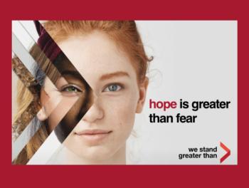Close-up of woman's face with "Hope is greater than fear" 