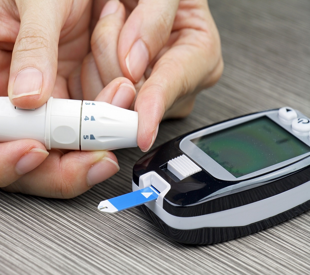 Finger testing with blood glucose machine