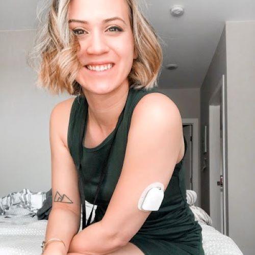 women smiling with insulin pump on arm