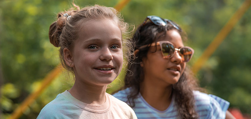 Two smiling young girls at diabetes camp