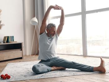 middle age man doing yoga